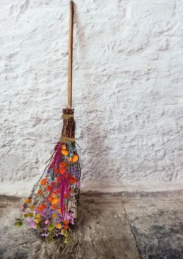 Witch's Flower Broomstick Halloween decoration similar to what you'll make on this flower workshop